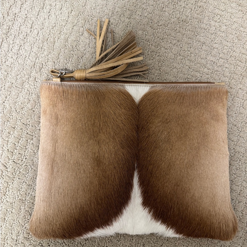 Hide clutch with zipper tassel